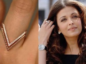 ঐশ্বর্যা রাই বচ্চনের (Aishwarya Rai Bachchan) হাতে থাকা ‘ভি’ চিহ্নের আংটির রহস্য উন্মোচন। জানুন কেন এই ‘ভ‍্যাঙ্কি আংটি’ তাঁর জীবনের অবিচ্ছেদ্য অংশ এবং এর ঐতিহ্যবাহী মানে কী।